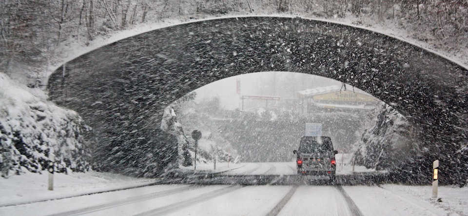 Car driving through a tunnel in the snow