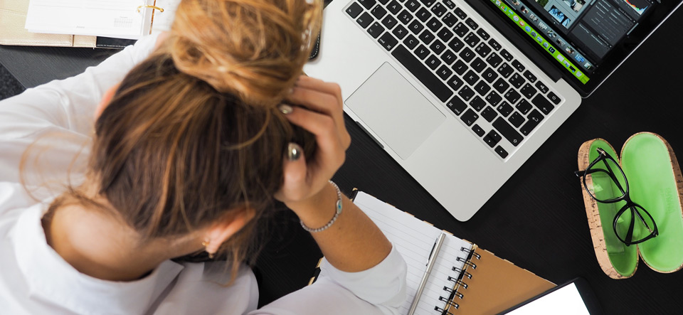 Woman in distress at computer