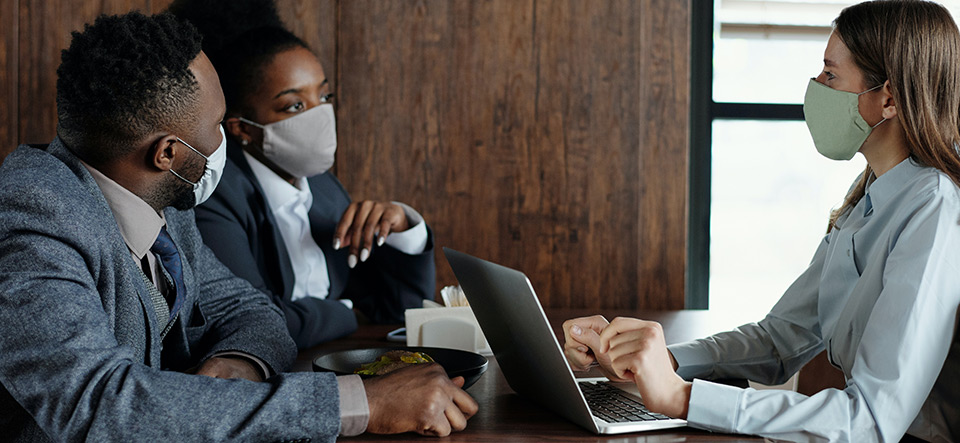 Group of coworkers meeting safely