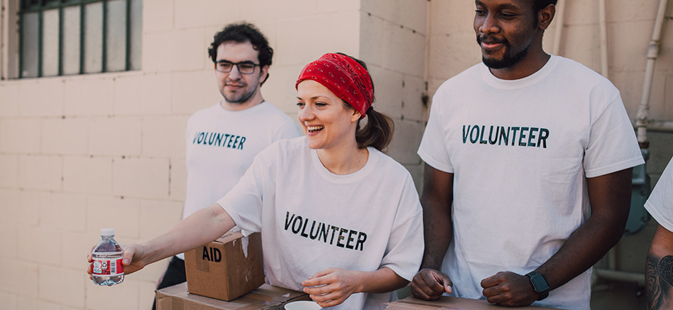 Volunteer workers handing out goods