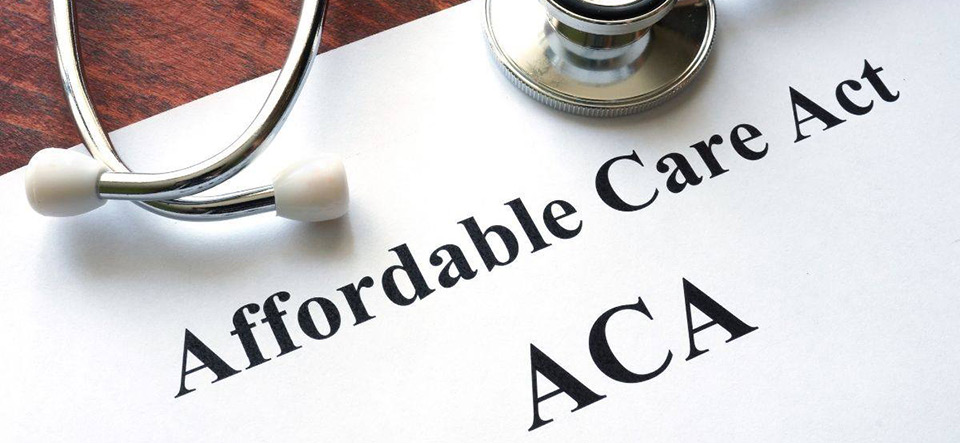 Medical instruments on a document titled Affordable Care Act ACA