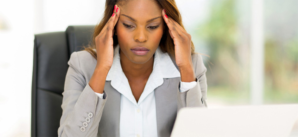 Stressed woman viewing a computer screen