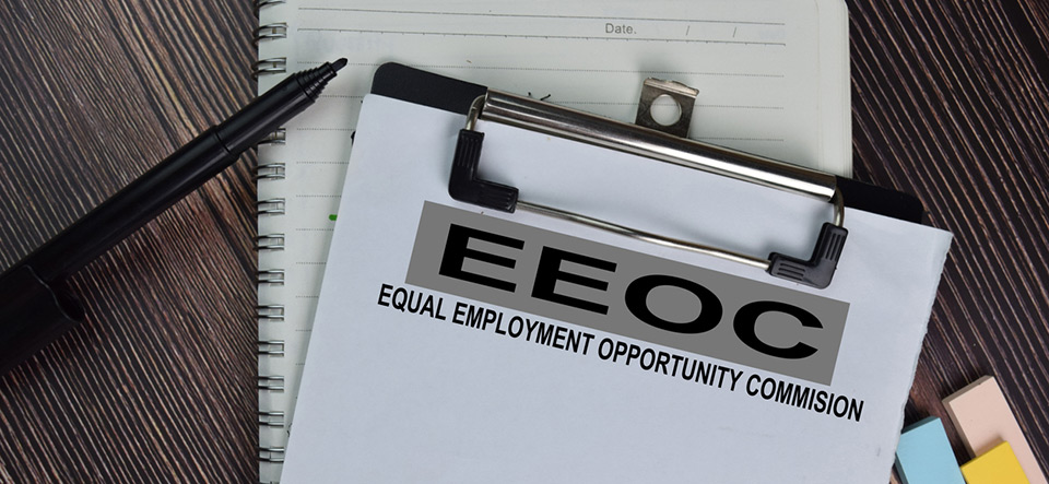 Equal Employment Opportunity Commission (EEOC) text on Document form isolated on office desk. (Equal Employment Opportunity Commission