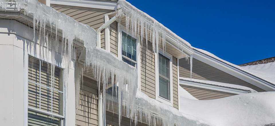 Ice dams and snow on roof and gutters