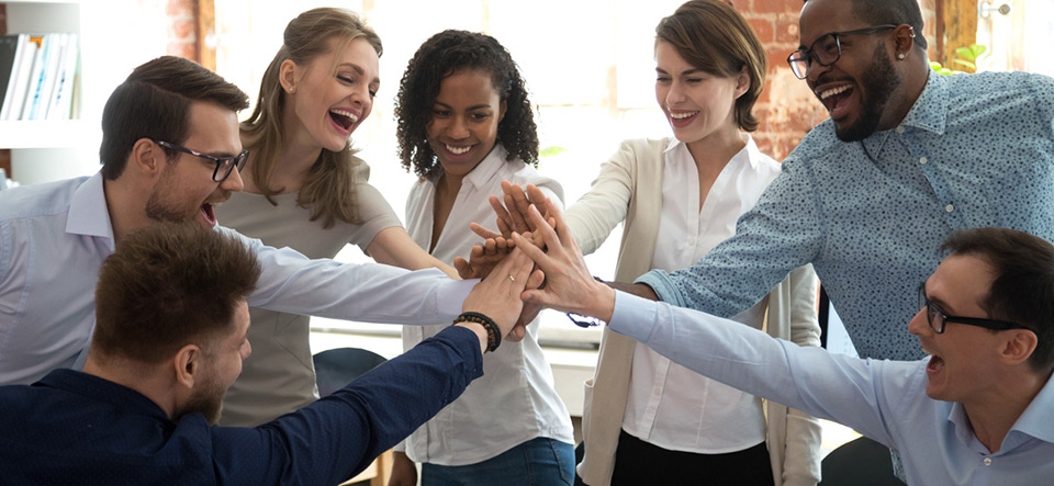 Happy diverse colleagues team people give high five together celebrate great teamwork result motivated by business success victory loyalty unity concept, good corporate relations and teambuilding