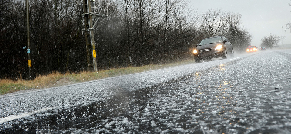 Hailstorm on the road in a summer day