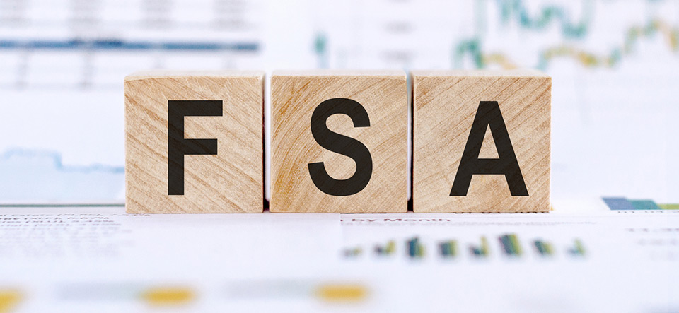 FSA abbreviation on background with financial graphs. Flexible Spending Account financial concept.