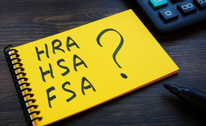 A Notepad with notes HRA, HSA, FSA and question mark.