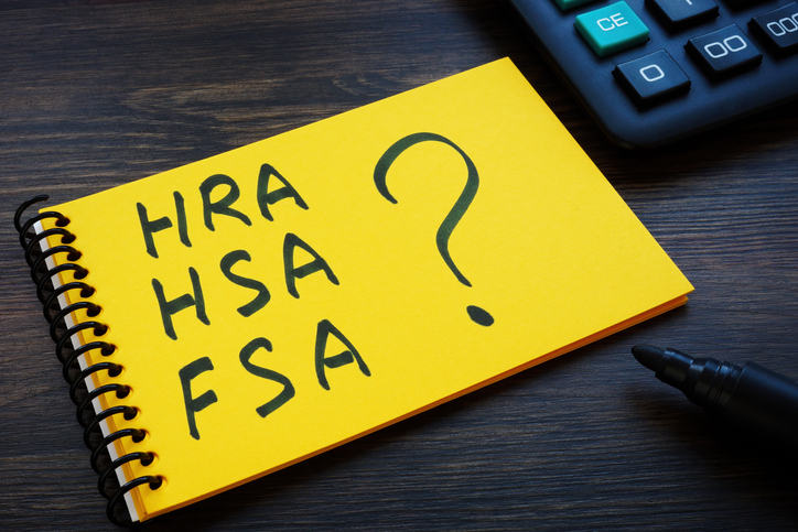 A Notepad with notes HRA, HSA, FSA and question mark.