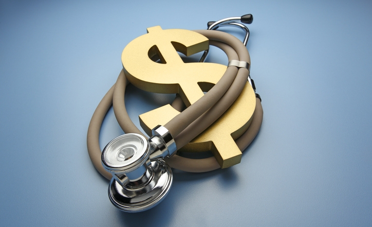 A stethoscope is wrapped around a large gold dollar symbol on a blue background representing the outrageous costs of health care and insurance.