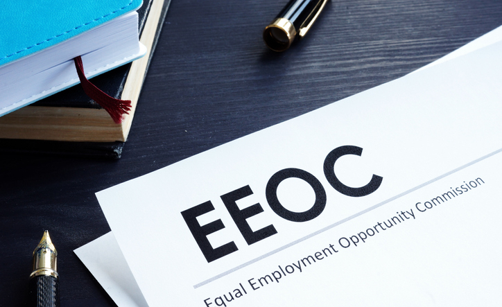 Equal Employment Opportunity Commission EEOC document and pen on a table.