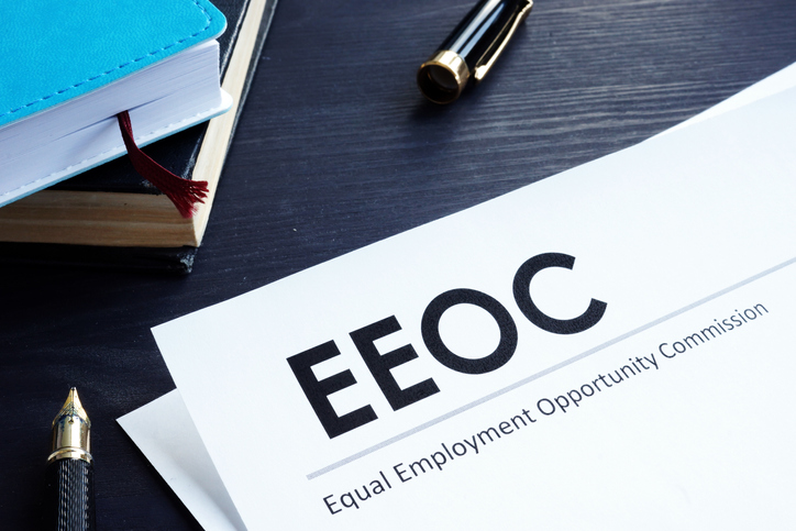 Equal Employment Opportunity Commission EEOC document and pen on a table.